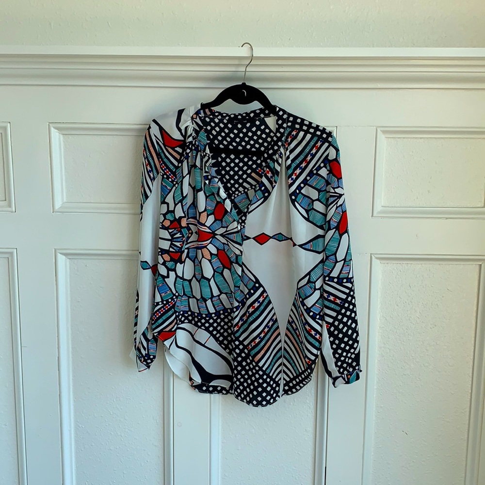 Colorful blouse with deep open neckline
